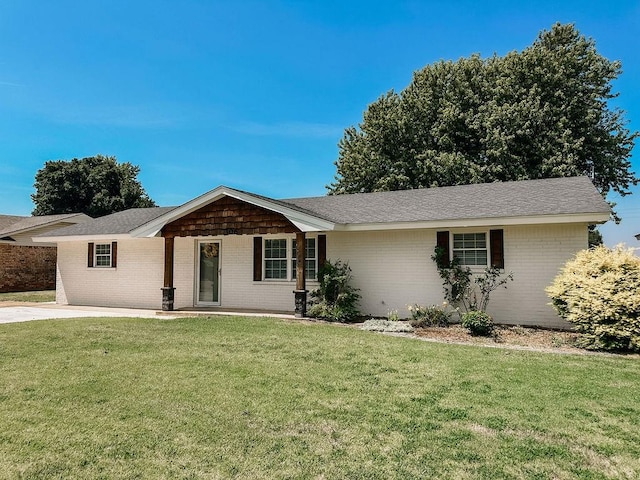 single story home featuring a front lawn and covered porch