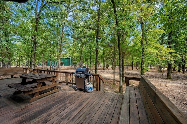 wooden terrace featuring grilling area