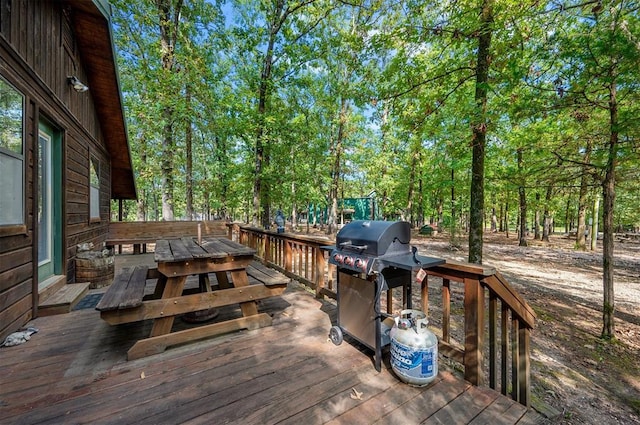 wooden deck with a grill