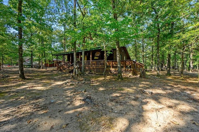 back of property with a wooden deck