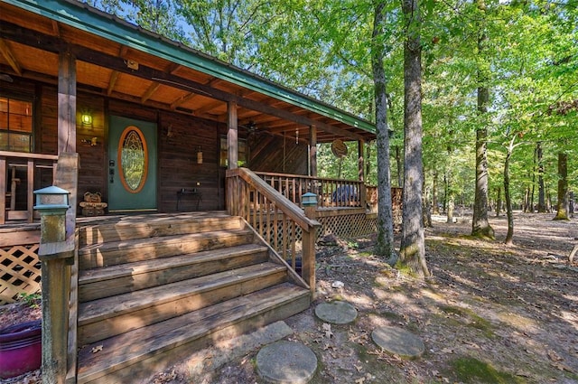 view of exterior entry with covered porch