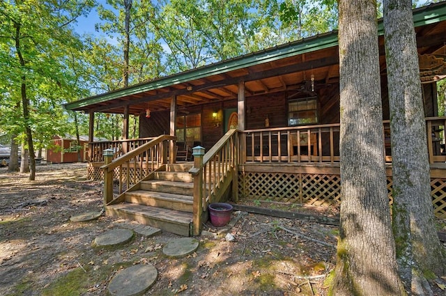 exterior space featuring ceiling fan and covered porch