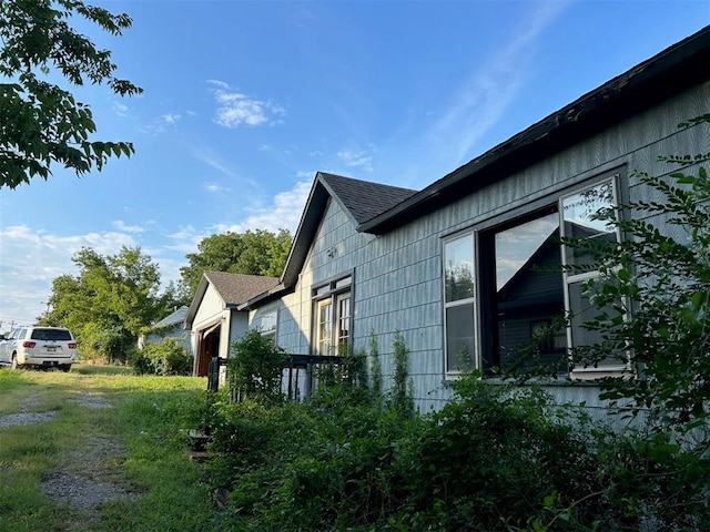 view of side of home featuring a garage