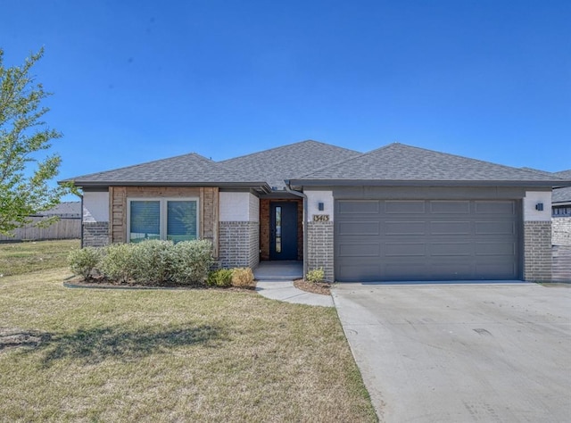 view of front of property with a garage and a front lawn