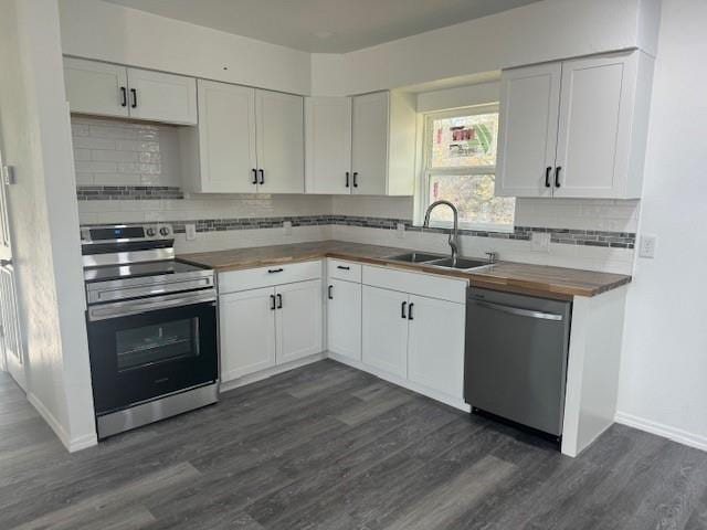 kitchen featuring white cabinets, appliances with stainless steel finishes, and sink