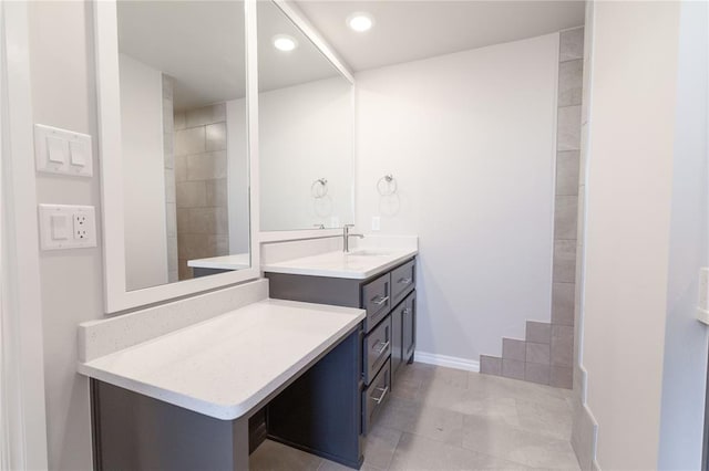 bathroom with tile patterned floors and vanity