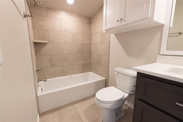 full bathroom featuring tiled shower / bath, vanity, tile patterned floors, and toilet