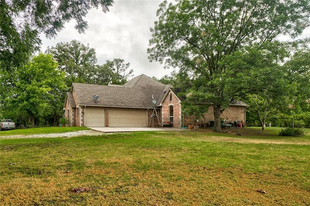 view of front facade with a garage and a front lawn