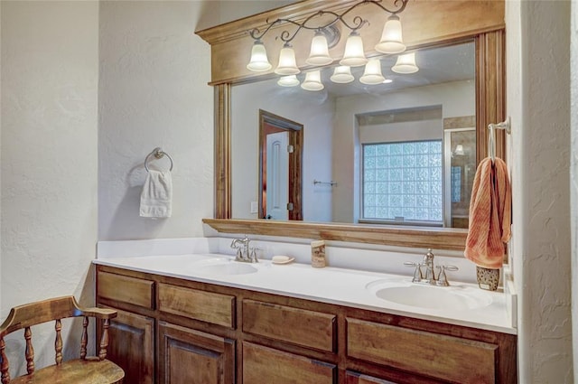 bathroom with vanity and a shower with shower door