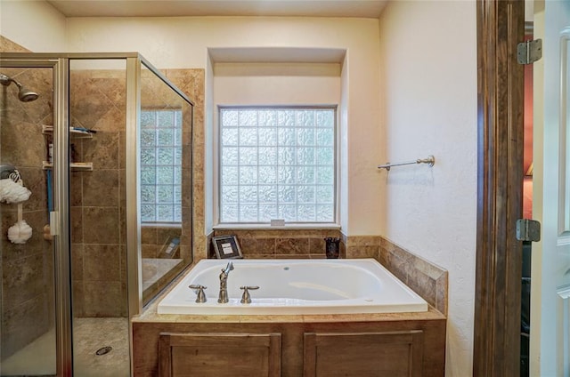 bathroom with shower with separate bathtub