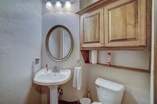 bathroom featuring toilet