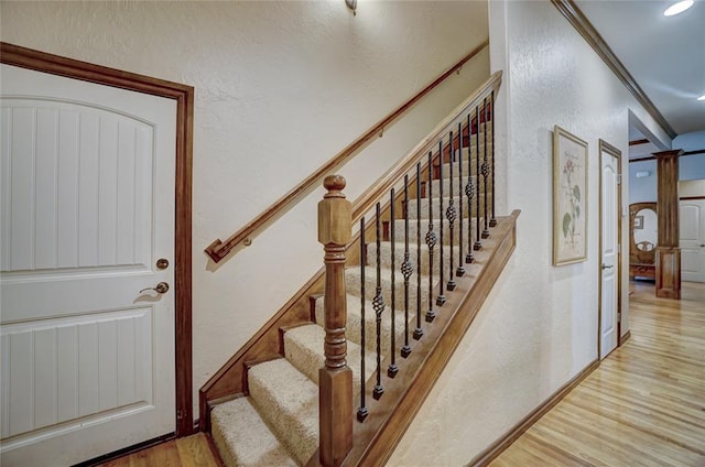 stairway with wood-type flooring