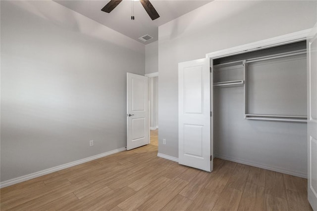 unfurnished bedroom featuring visible vents, baseboards, a closet, a ceiling fan, and light wood finished floors