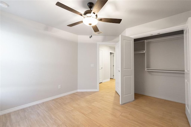 unfurnished bedroom with visible vents, a closet, baseboards, a ceiling fan, and light wood-style floors