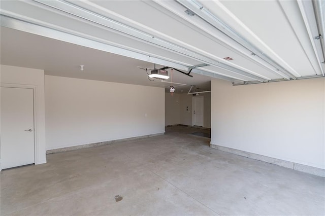 garage featuring a garage door opener