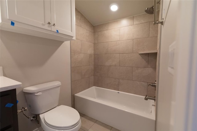 full bathroom featuring tile patterned floors, toilet, vanity, and tiled shower / bath