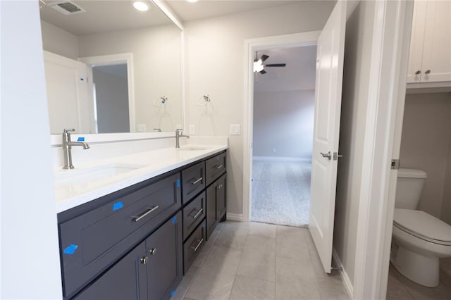 bathroom with toilet and vanity