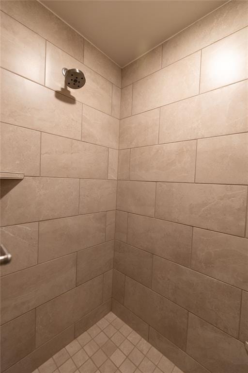 bathroom with tiled shower