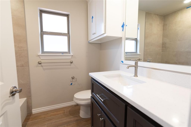 bathroom with toilet and vanity