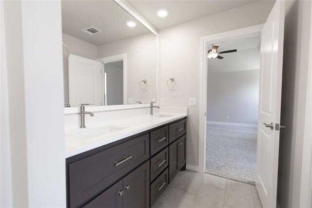 8709 Tyrion Dr, Edmond, OK 73007 - full bath with ceiling fan, double vanity, visible vents, and a sink