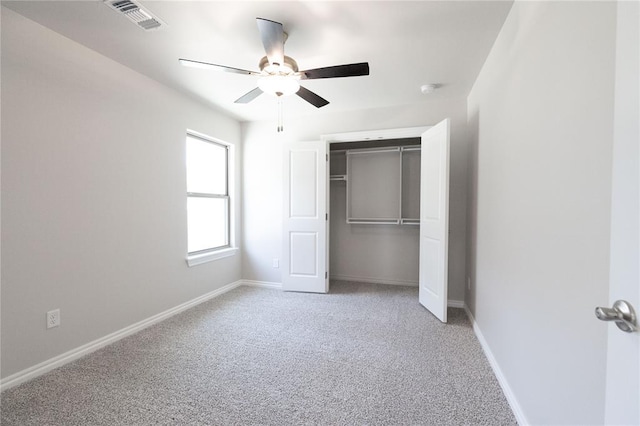 8709 Tyrion Dr, Edmond, OK 73007 - unfurnished bedroom featuring visible vents, a ceiling fan, a closet, baseboards, and light colored carpet