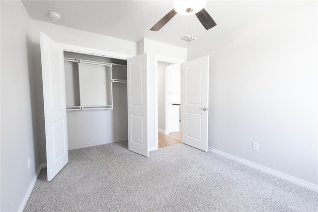 8709 Tyrion Dr, Edmond, OK 73007 - unfurnished bedroom with a closet, baseboards, visible vents, and carpet floors