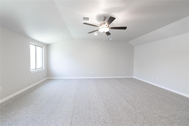 8709 Tyrion Dr, Edmond, OK 73007 - empty room with visible vents, baseboards, ceiling fan, and vaulted ceiling