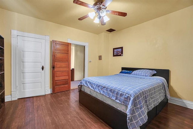 bedroom featuring dark hardwood / wood-style floors and ceiling fan