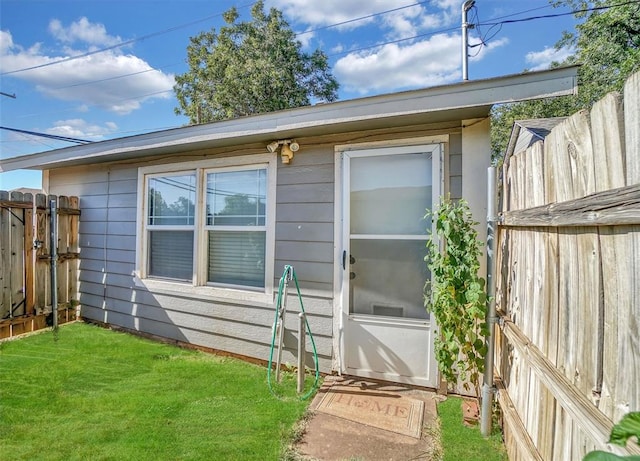 entrance to property with a yard