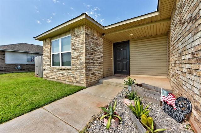 doorway to property featuring a yard