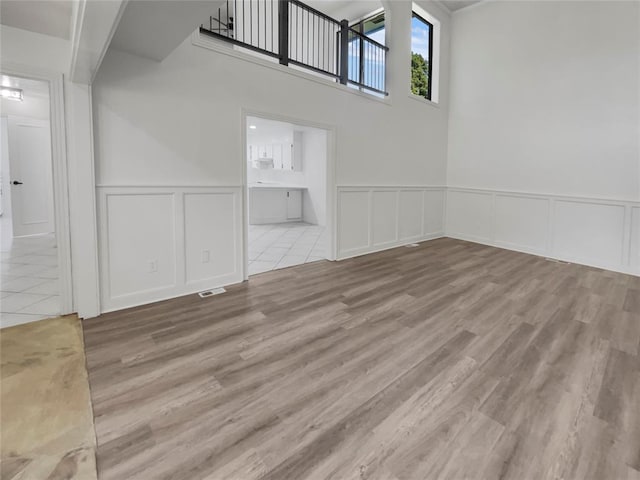 unfurnished living room featuring light hardwood / wood-style floors