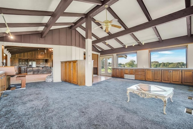 carpeted living room featuring beamed ceiling, ceiling fan, and high vaulted ceiling