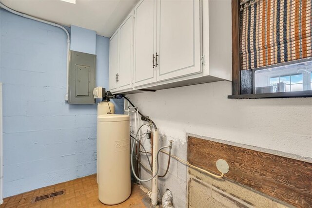 103 Park Dr, Sayre, OK 73662 - detailed view of a water softener system and electric panel