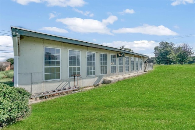 view of property exterior featuring a yard