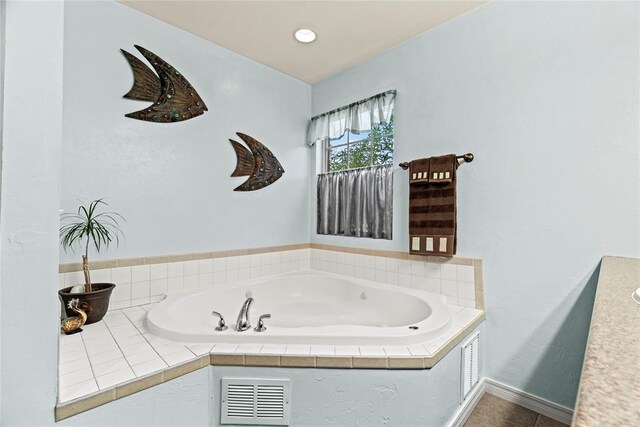 bathroom with tiled bath