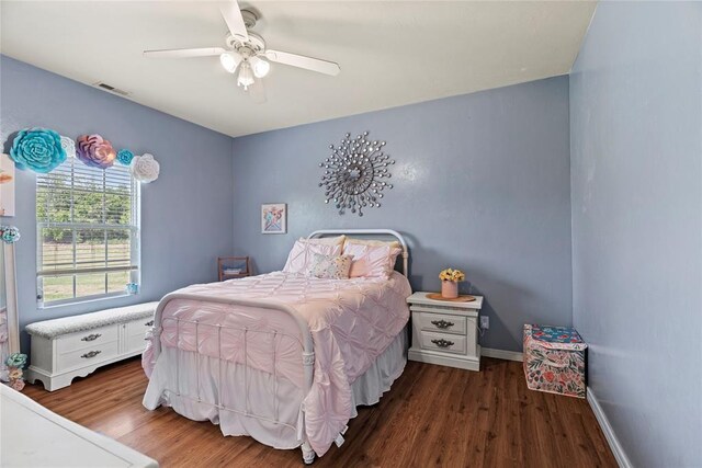 bedroom featuring ceiling fan and dark hardwood / wood-style floors