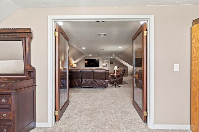 carpeted bedroom with vaulted ceiling