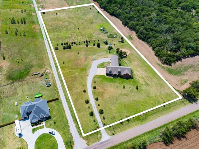 birds eye view of property with a rural view