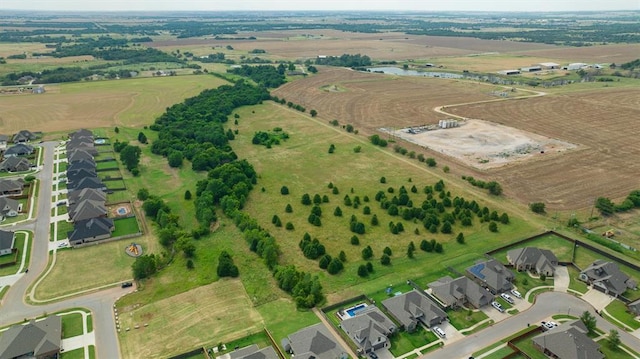 bird's eye view with a rural view and a water view