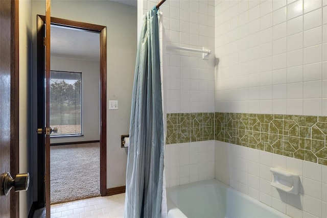 bathroom with shower / bath combination with curtain