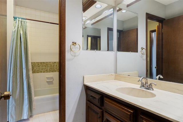 bathroom featuring tile patterned floors, vanity, and shower / bath combo