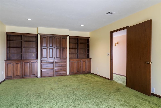 unfurnished living room with light carpet