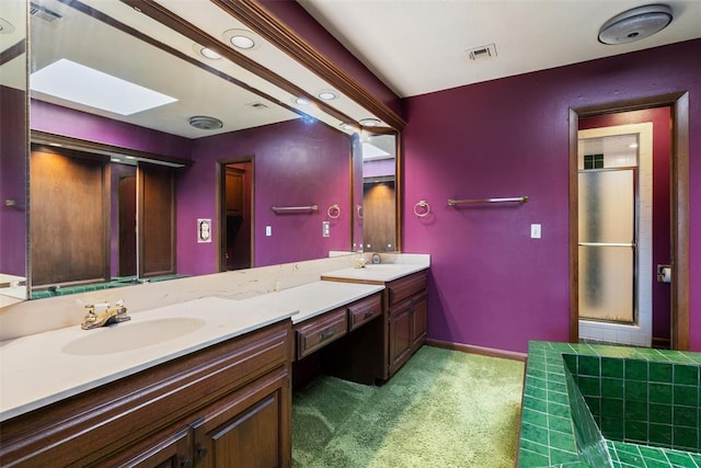 bathroom featuring vanity and an enclosed shower