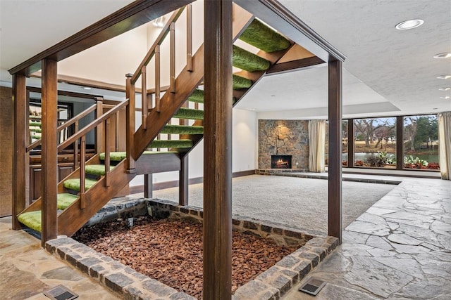 view of patio featuring a stone fireplace