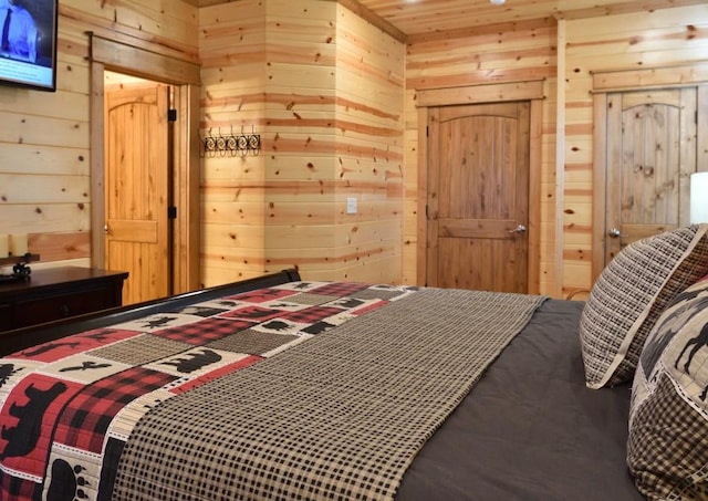 bedroom with wood walls