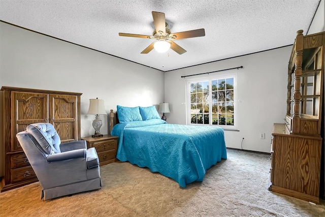 bedroom with light carpet, a textured ceiling, and ceiling fan