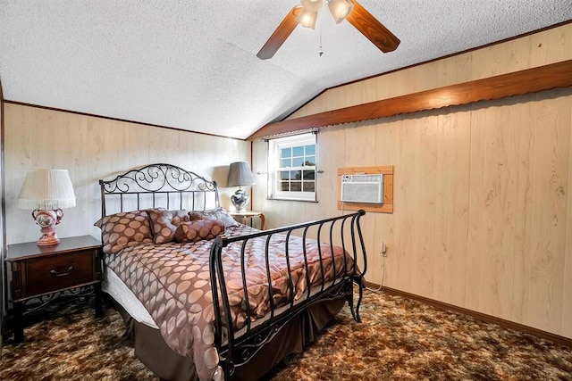 bedroom featuring ceiling fan, wood walls, and vaulted ceiling