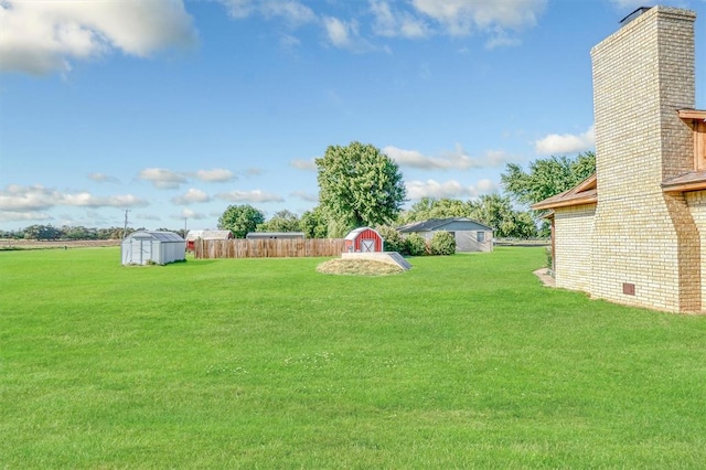 view of yard with a storage unit