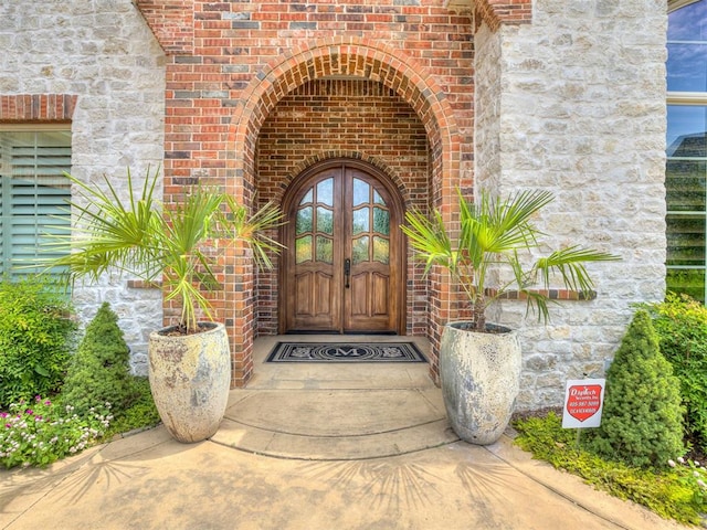 entrance to property featuring french doors