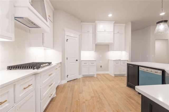 kitchen with dishwasher, light countertops, light wood finished floors, and white cabinetry